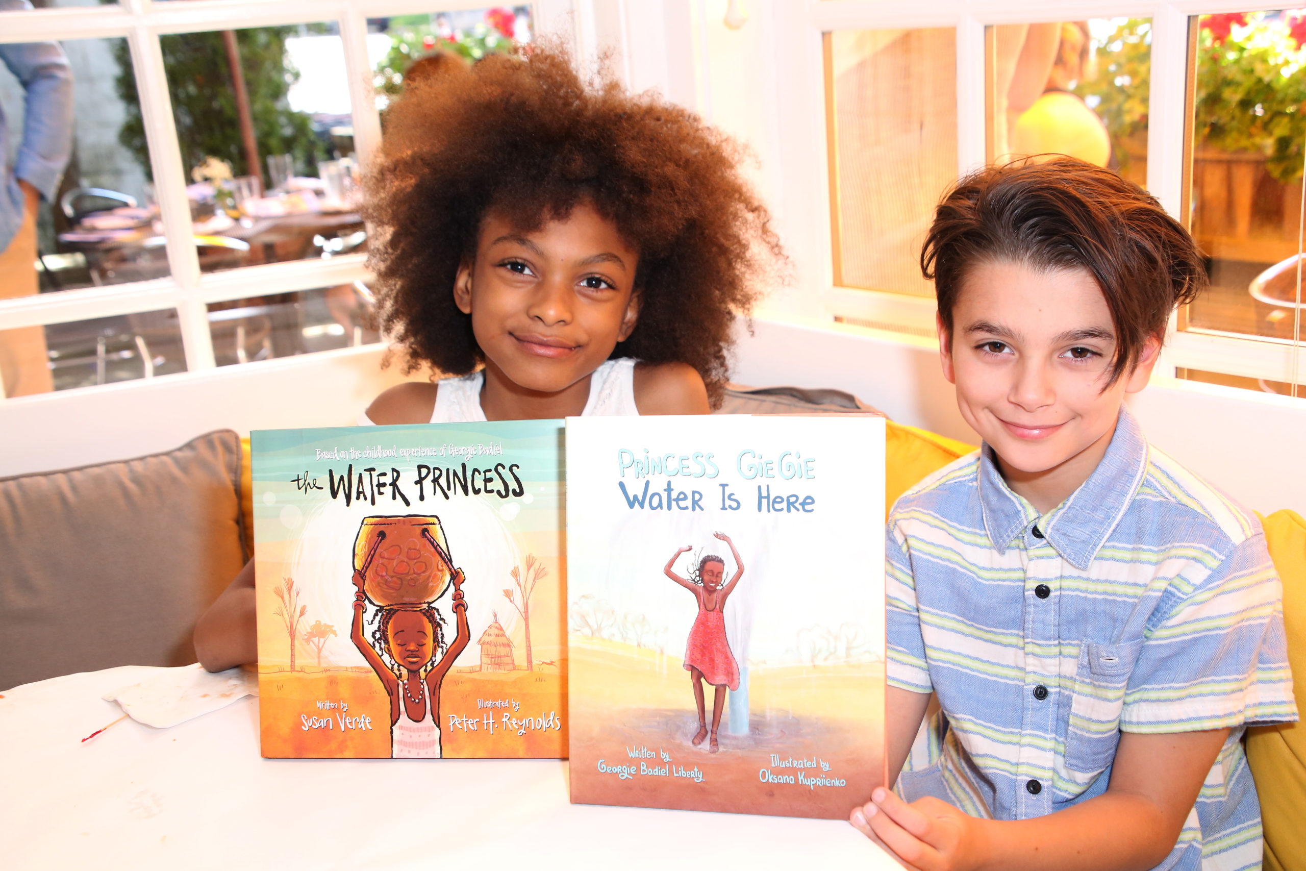Children posing with books